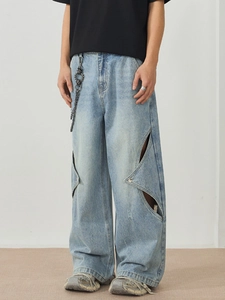 Men's light blue wide-leg jeans with unique geometric cut-outs and a stylish metal chain