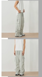 Detail of light green quick-dry cargo pants featuring side pockets and adjustable drawstrings