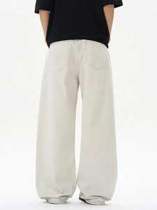 Back view of loose fit off-white wide-leg straight denim pants with vintage stone wash