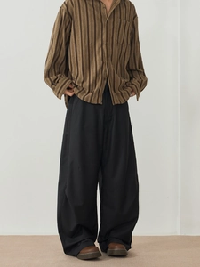 Men's stylish black wide-leg trousers with brown striped long-sleeve shirt