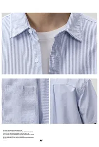 Detail view of blue and white striped short-sleeved shirt with breast pocket and white buttons