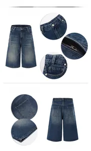 Detailed close-up of dark blue washed denim shorts featuring YKK zipper and metal button
