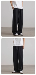 Detailed view of black wide-leg sweatpants with 3D structural stitching and drawstrings