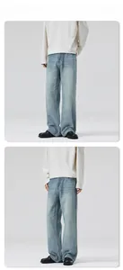 Details der hellblau gewaschenen Denim-Jeans mit Vintage-Whiskers und weitem, geradem Bein
