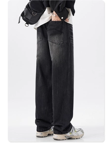 Detail view of baggy retro washed black denim pants with street style loose fit