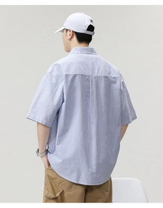 Detail of blue and white striped men's short sleeve shirt with back shoulder seam
