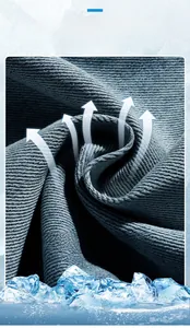 Macro shot of dark blue lyocell denim fabric showing breathable twill texture and sheen