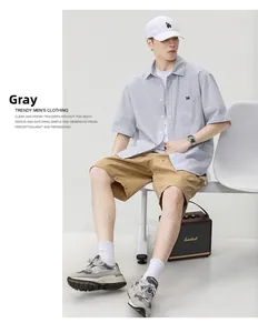 Detail of gray striped cotton short sleeve shirt and khaki cargo shorts outfit set
