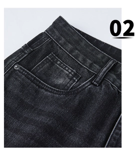 Detailed macro view of retro black grey washed denim waist belt loops and metal rivets