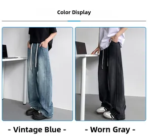 Detail of wide-leg jeans showing retro blue and vintage gray washes with side stripe stitching