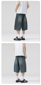 Detailed back view of vintage washed baggy denim shorts with lightning pattern stitching