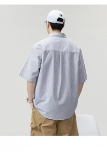 Rear view of a blue and white striped short-sleeve shirt in a loose casual fit