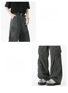 Detail of dark gray washed cargo pants showing side flap pockets and leg opening style
