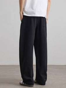 Men's wide-leg black sweatpants with elastic drawstring waist and street style fit