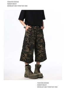 Detail shot of multi-pocket camouflage cargo shorts in a loose wide-leg fit for men