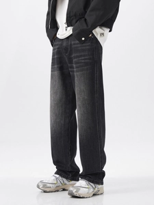 Men's relaxed fit distressed black washed jeans with vintage whisker detailing