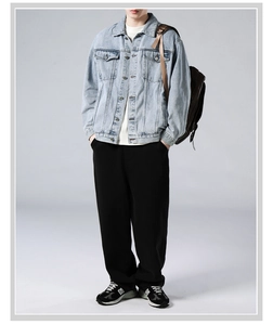 Classic light blue washed denim jacket with metal buttons and chest pockets detail