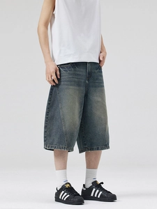 Men's retro washed denim shorts featuring wide-leg fit and vintage whiskering details