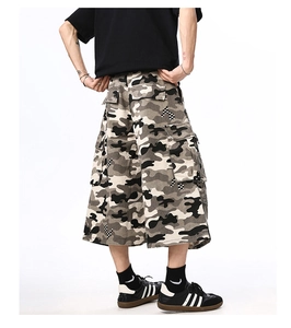 Rear view of loose-fit camouflage cargo shorts with multi-pocket design on white background