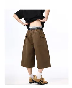 Rear view of men's brown cotton cargo shorts featuring back flap pockets and a black belt