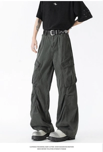 Detail view of washed vintage cargo pants featuring multiple pockets and pleated texture