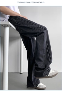Detail of multi-needle stitching on men's dark gray lyocell straight leg jeans