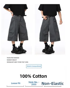 Detail of dark grey cargo shorts in 100% cotton twill with large side flap pockets