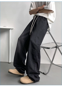 Detail of grey ice silk lyocell straight jeans showing high waist drawstring and side seams