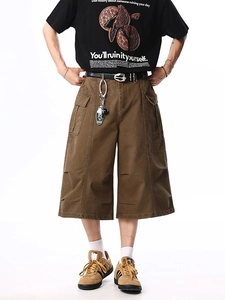 Brown heavy cotton canvas cargo shorts with wide leg cut and large side pockets for men