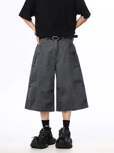Men's wide-leg cargo shorts in charcoal grey with distressed ripped details and pockets
