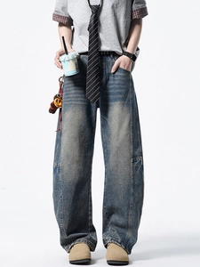 Jean homme rétro délavé bleu coupe large style High Street avec détails patchwork