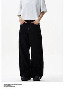 Detail view of high-waisted black wide-leg denim jeans with visible topstitching details