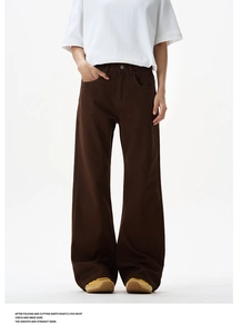 Front view of men's dark brown wide-leg trousers with rivet details and side pockets