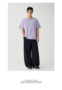 Minimalist lavender short sleeve t-shirt paired with navy wide-leg pants in loose fit