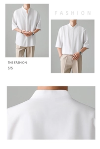 Detail of white Mandarin collar shirt showing the smooth fabric and minimalist hidden placket