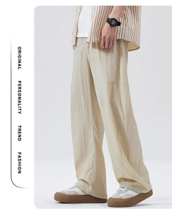 Detailansicht der khakifarbenen Wide-Leg-Hose mit fließender Textur im Streetstyle-Look