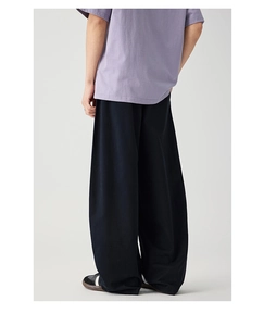Rear view of wide-leg cargo pants in dark navy with a relaxed straight-cut silhouette