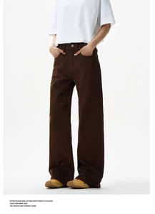 Detail of high-waist dark brown cotton twill flare trousers with metal button fly