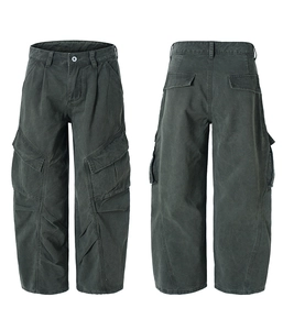Macro detail of high street washed grey cargo pants showing multi-pocket design and texture