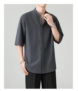 Detail of grey Mandarin collar shirt showing premium fabric texture and hidden placket