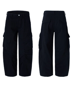 Detail view of black multi-pocket cargo pants with washed effect and loose straight cut