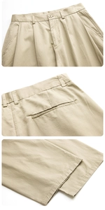 Macro detail of khaki cargo pants showing button waist, pleats, and premium cotton texture