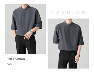 Detail of dark grey short sleeve shirt featuring a mandarin collar and smooth icy silk fabric