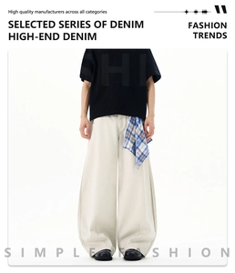 Detail of high-end cream wide-leg denim pants with blue plaid handkerchief accessory