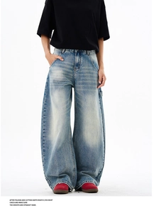 Detailed view of Carpenter style hanging loop on light blue washed denim jeans