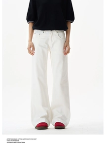 Macro detail of high-waist white wide-leg trousers showing cotton twill fabric texture
