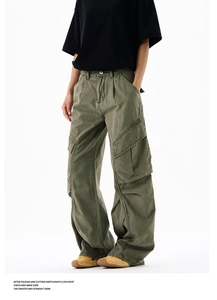 Close-up of military green cargo pants showing stitching details and large side pockets