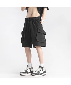 Close-up of quick-dry cargo shorts featuring large side pockets and adjustable buckle belt