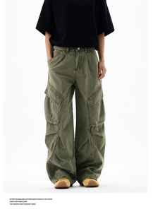 Detailed view of cargo pants featuring side flap pockets and pleated knee design