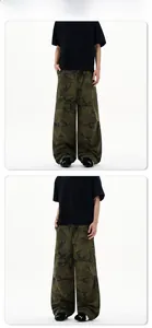 Detailed view of oversized camouflage cargo pants in loose fit streetwear style